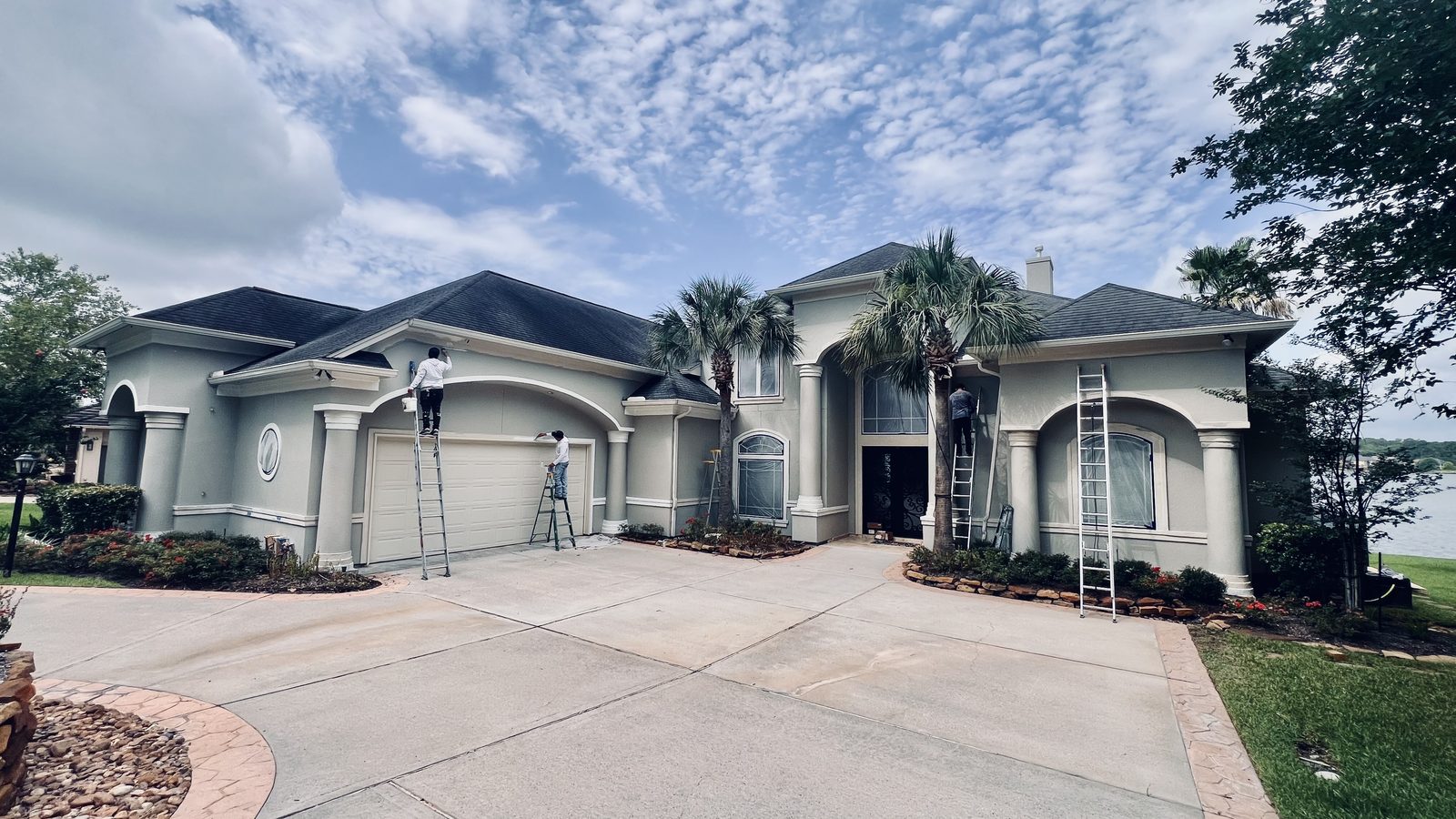 Freshly painted stucco home with crisp white trim